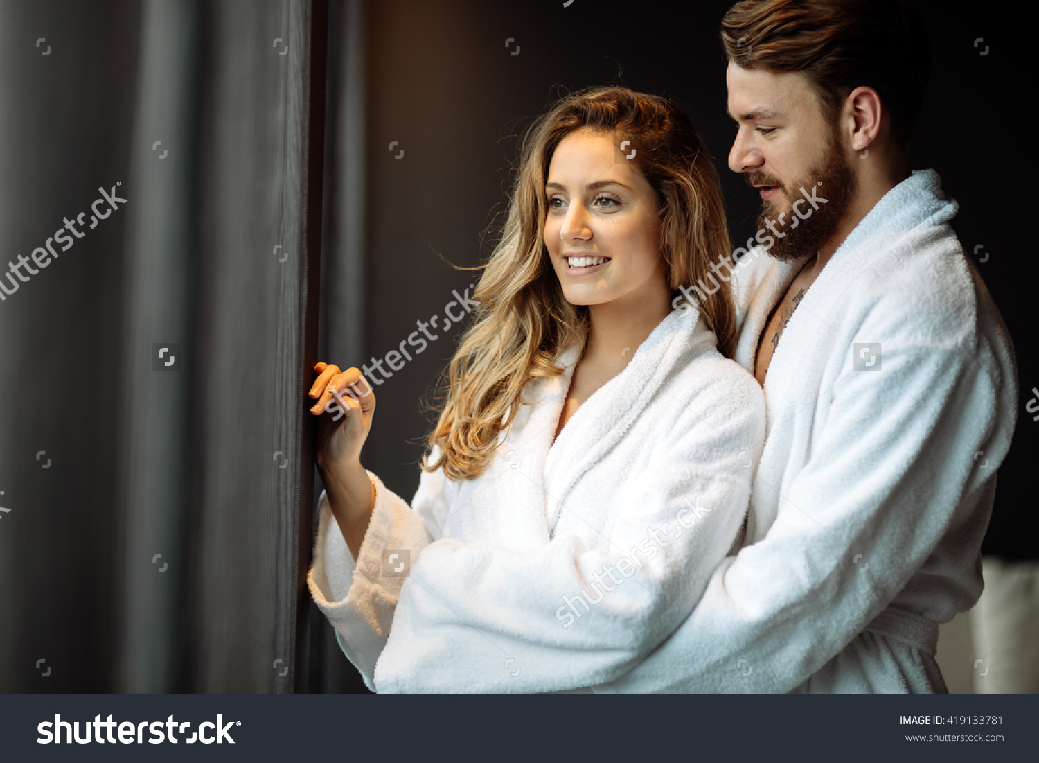 stockphotocoupleinbathrobesenjoyinghoneymooninsparesort